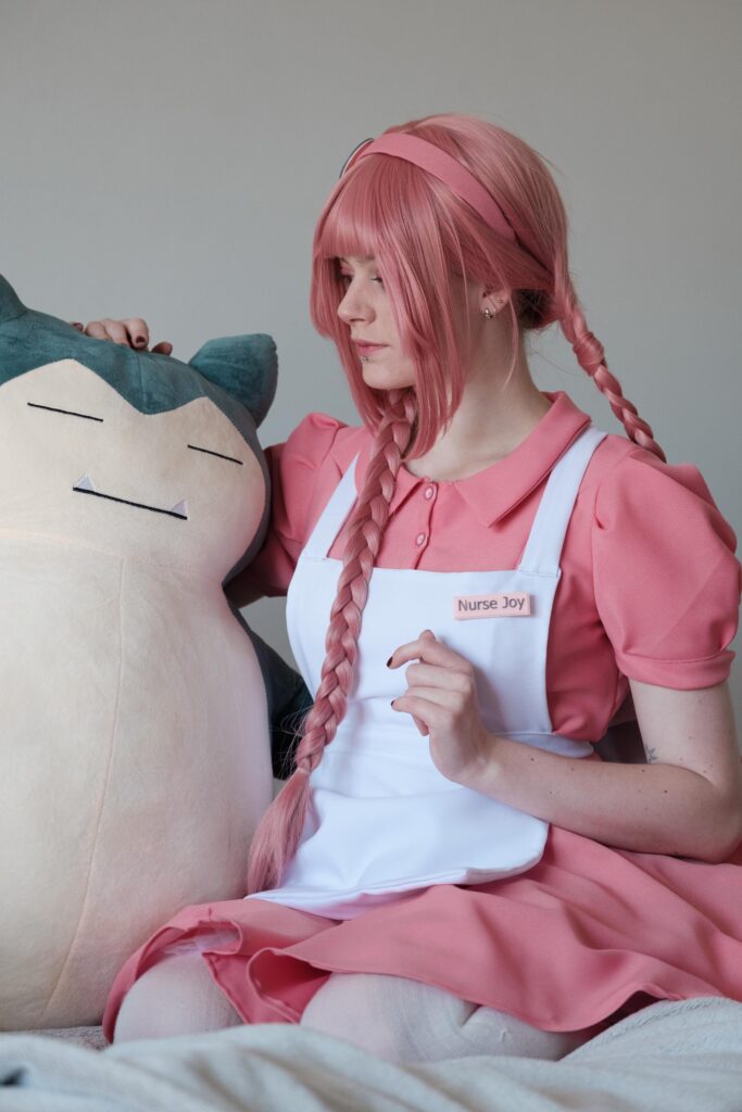 Nurse Joy comforting a snorlax
