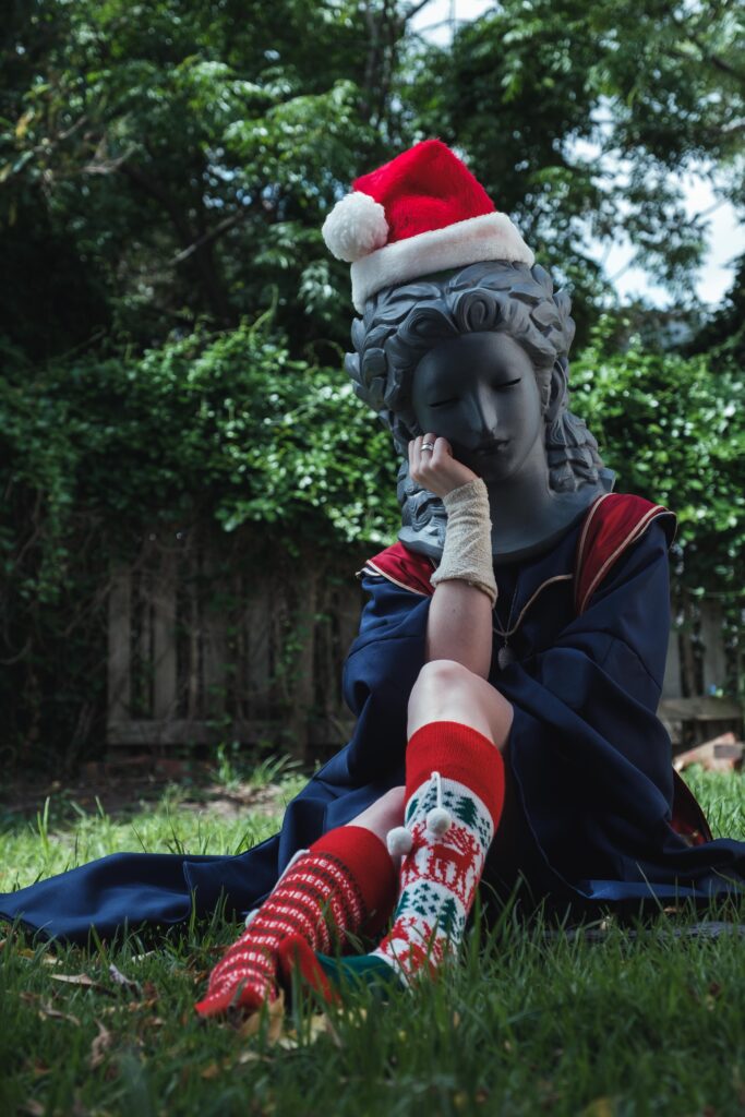 Sellen cosplayer wearing Santa hat and socks