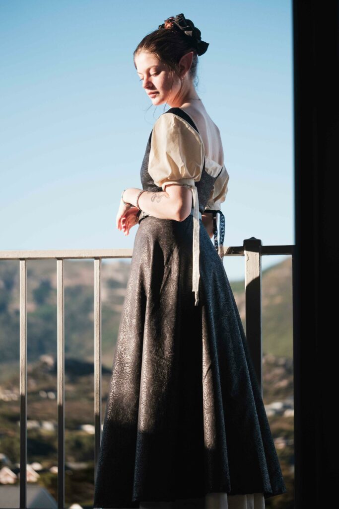 Chris In Costume standing in custom dress made for an event